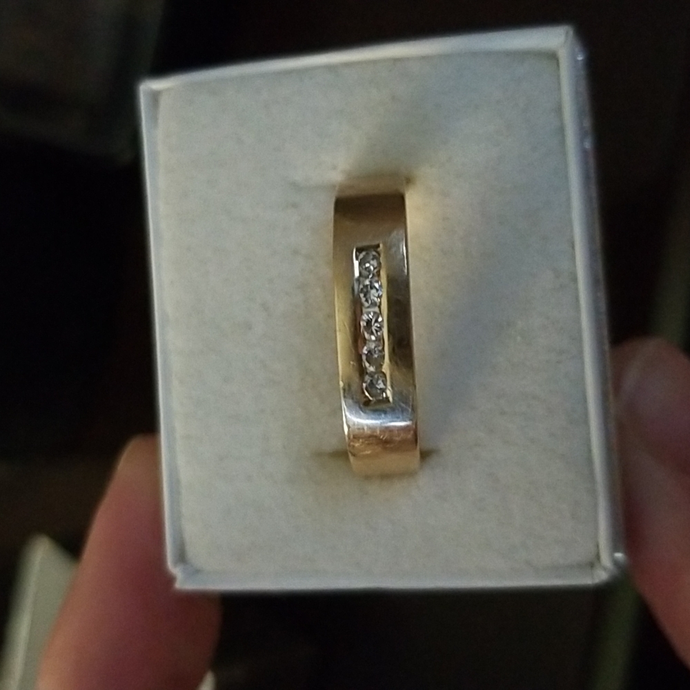 10k yellow gold with aprox .10 diamond weight
